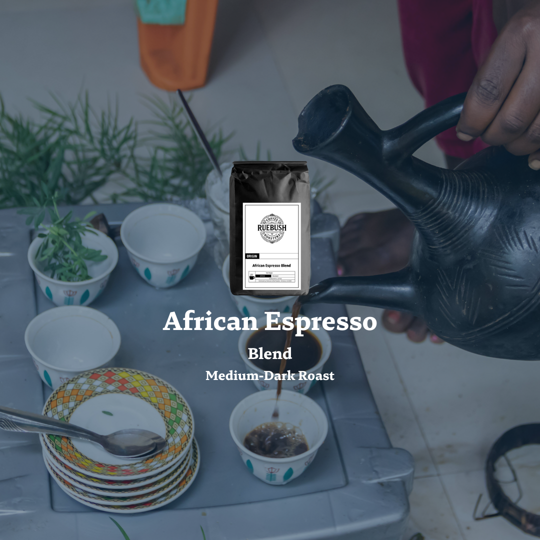 Person pouring coffee into a cup with a Ruebush Coffee Roasters bag labeled African Espresso Blend displayed.