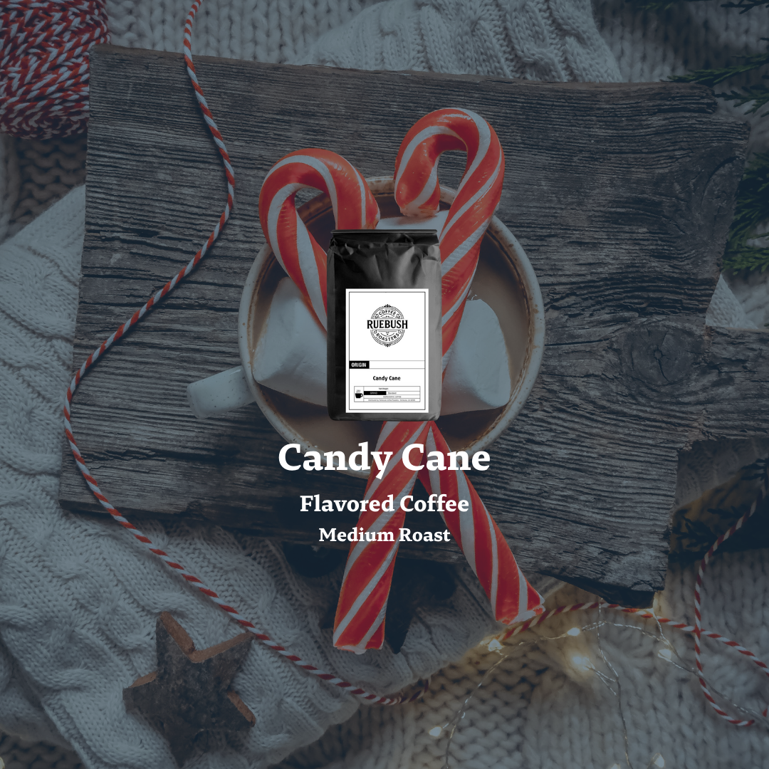 Candy Cane Flavored Coffee package with candy canes on coffee mug and a wooden surface