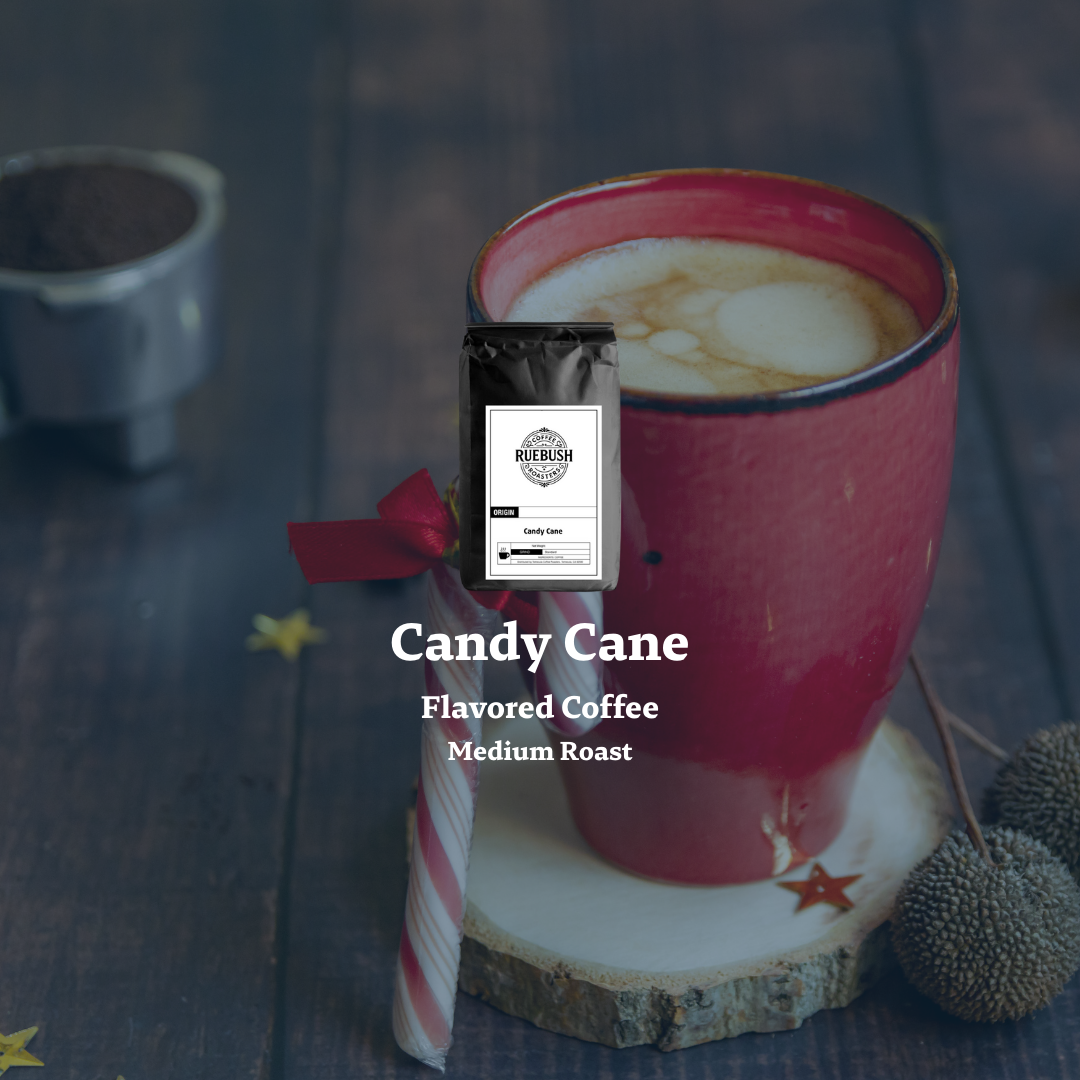 Red mug with candy cane flavored coffee on a wooden coaster, surrounded by holiday decor