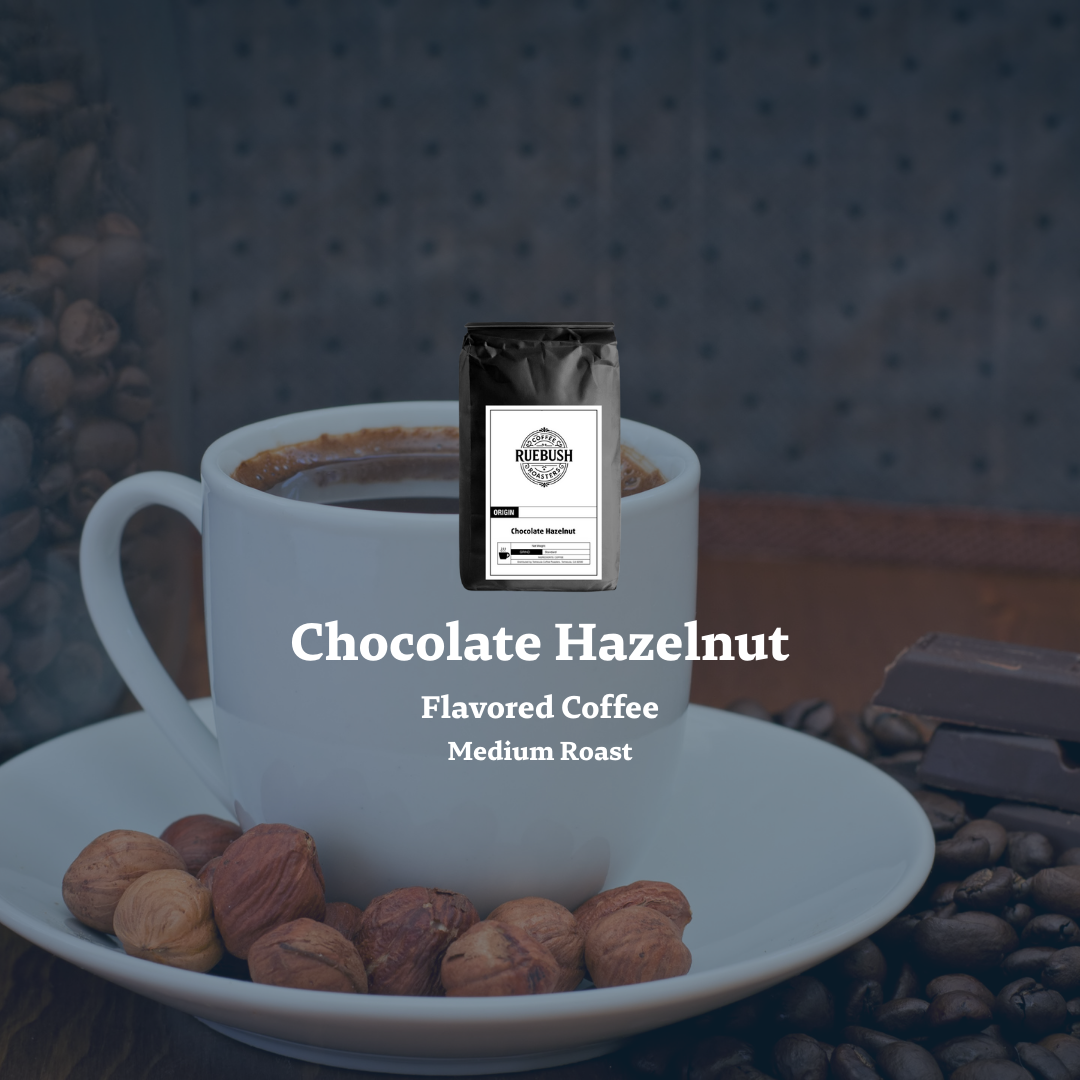 White mug with chocolate hazelnut flavored coffee, surrounded by nuts and coffee beans on a dark background