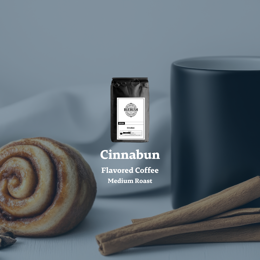Cinnabun flavored coffee package with a cinnamon roll and sticks on a gray background