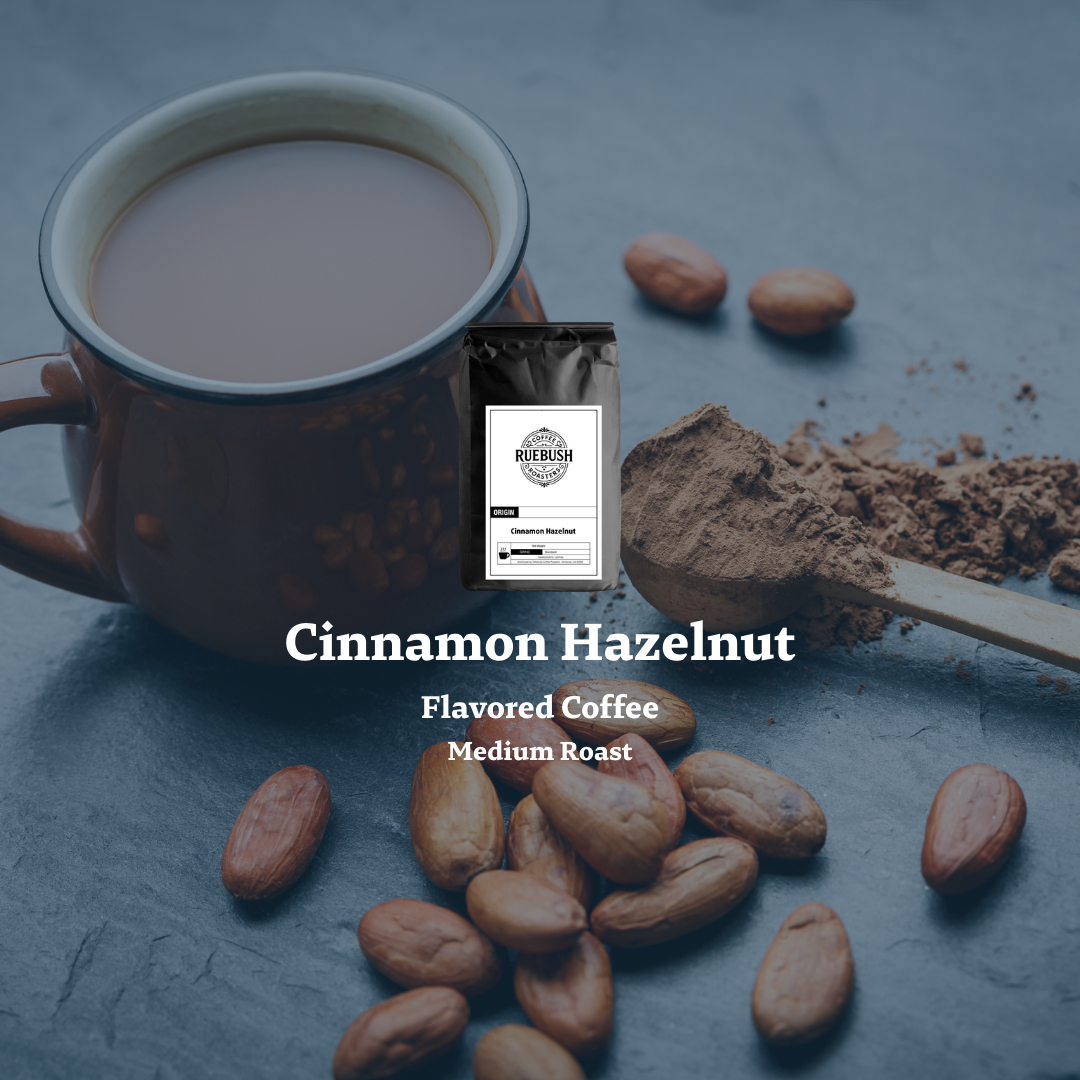 Cinnamon Hazelnut flavored coffee with a cup of coffee, coffee beans, and a package on a dark surface