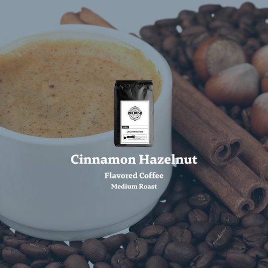 Cinnamon Hazelnut flavored coffee package with a cup of coffee, coffee beans, and cinnamon sticks on a light blue background