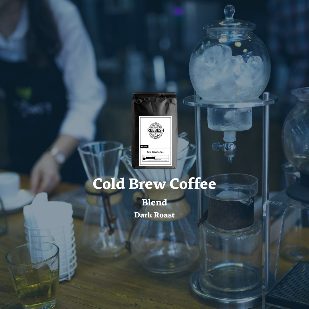 Cold brew coffee setup with a bag of coffee blend on a wooden counter