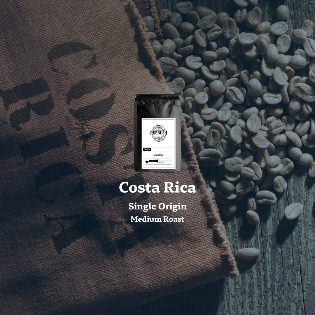 Brown bag labeled Costa Rica with coffee beans on a dark surface and text indicating single origin and medium roast