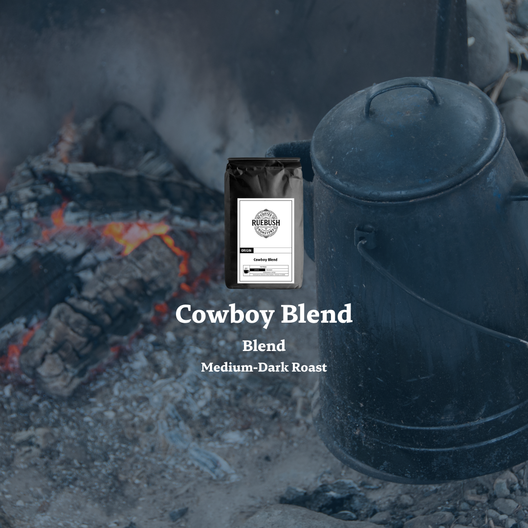Coffee bag labeled Cowboy Blend with a rustic background featuring a campfire and coffee kettle