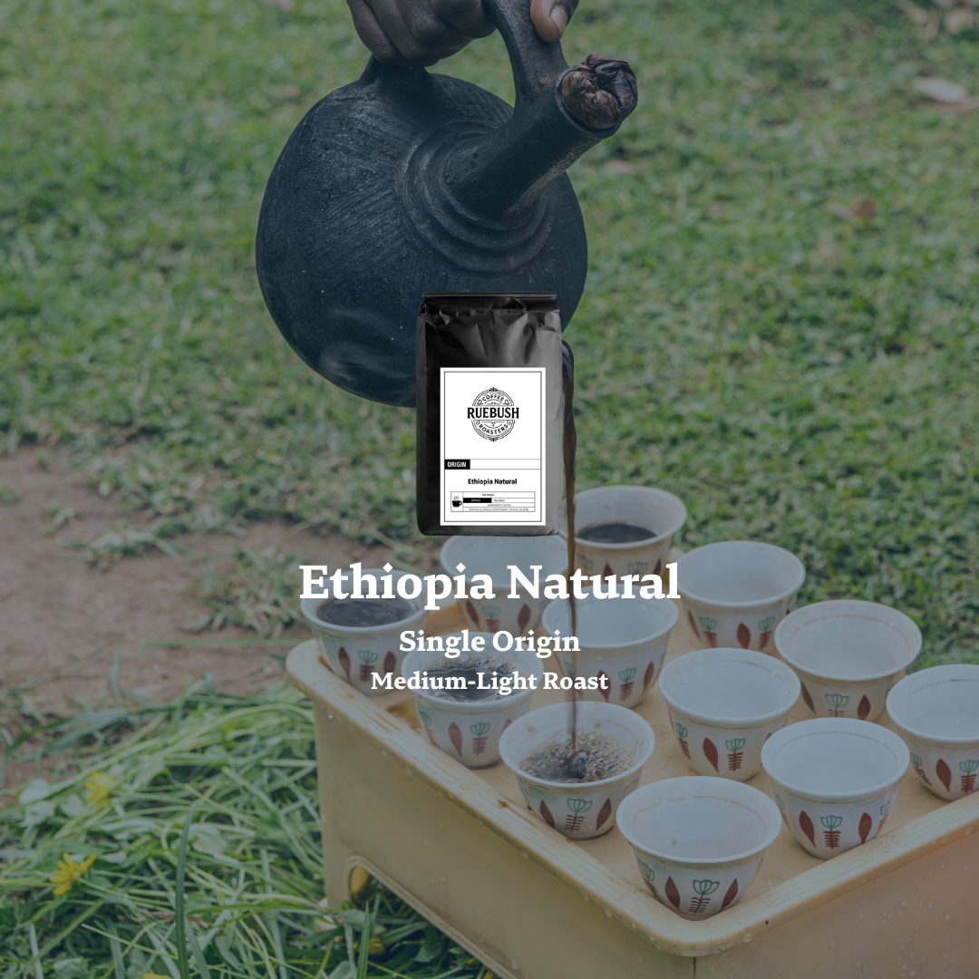 Ethiopia Natural single origin coffee being poured into small cups on a grassy background