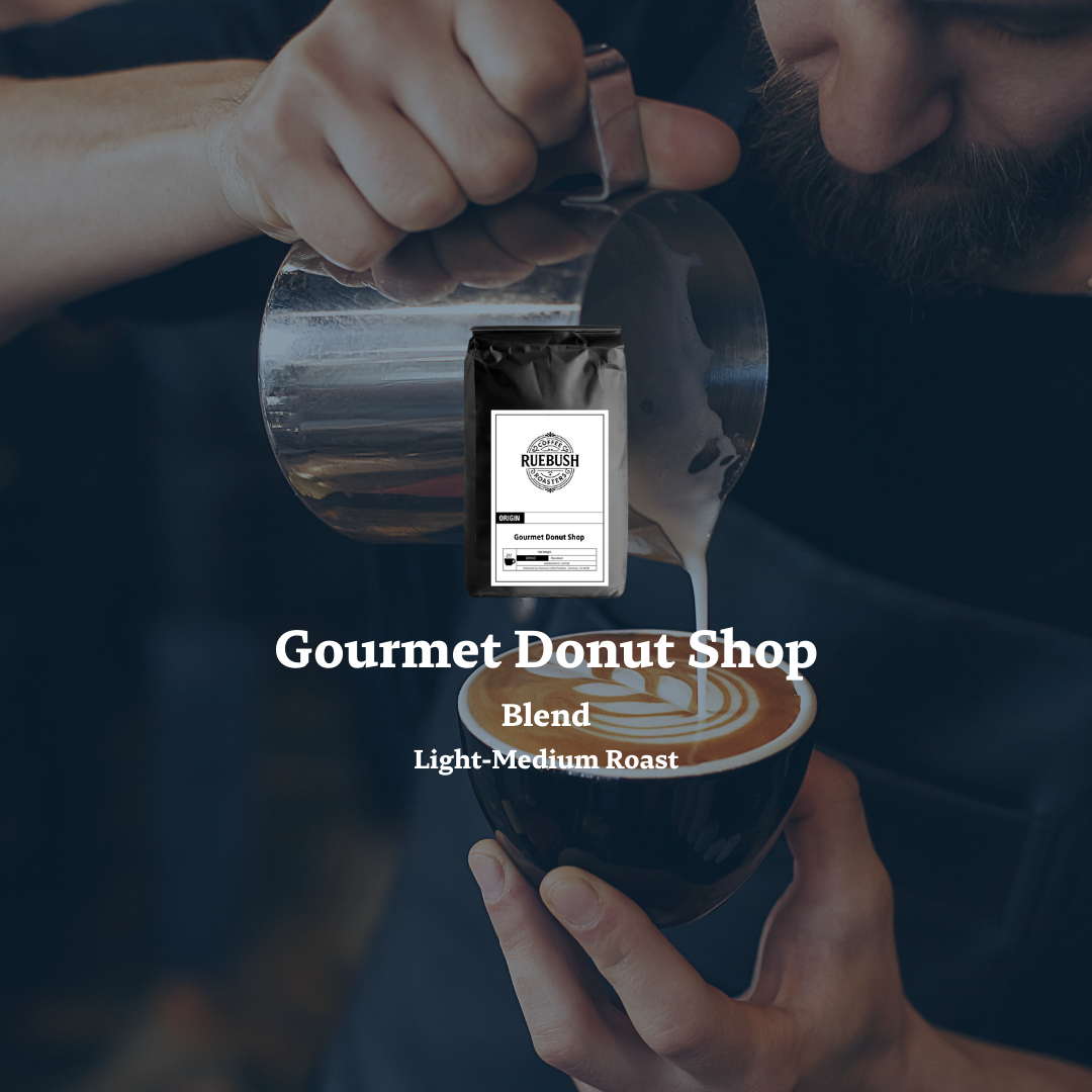 Person pouring coffee from a carafe into a cup with a Gourmet Donut Shop Blend package by Ruebush Coffee Roasters in the foreground
