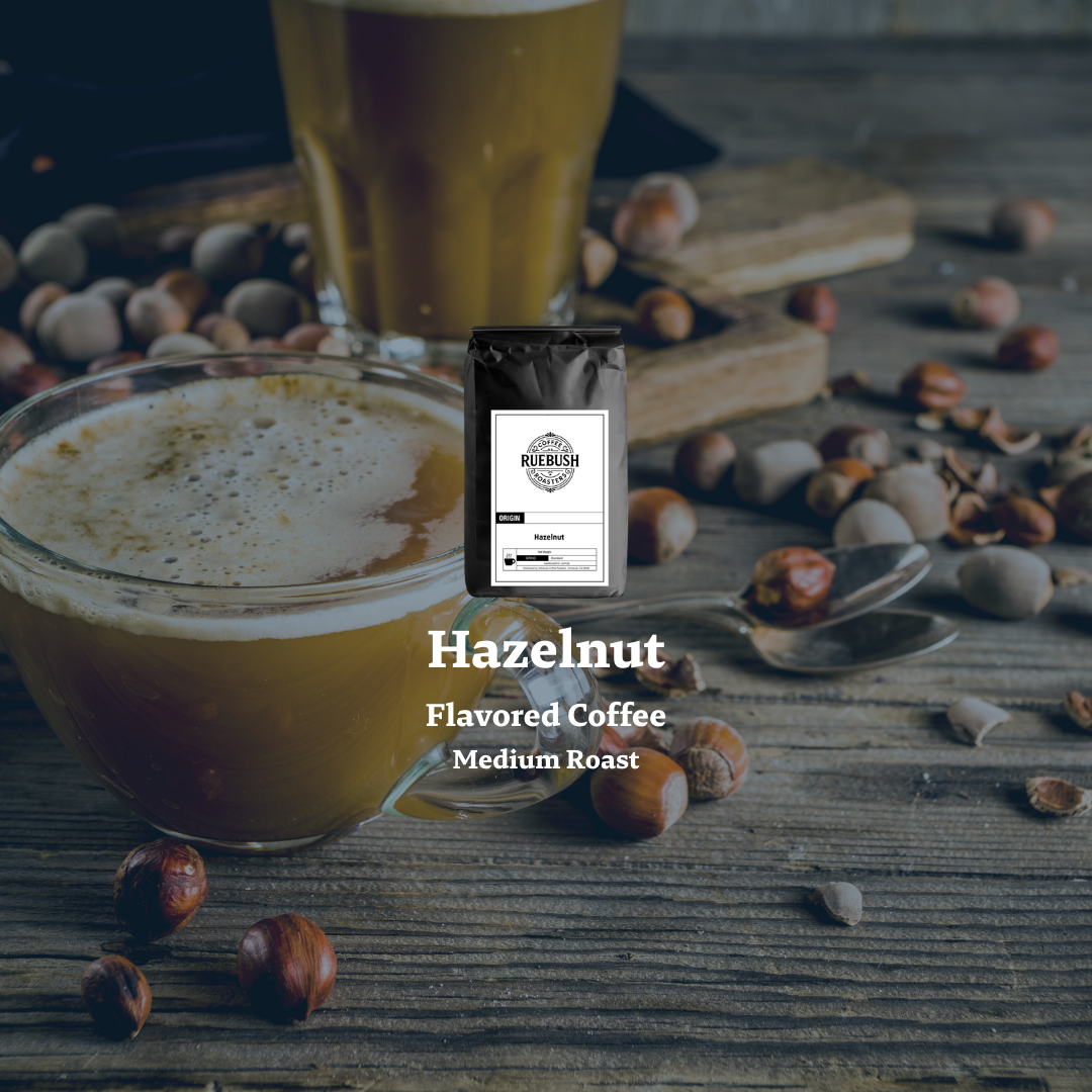 Hazelnut flavored coffee with a package labeled Hazelnut Flavored Coffee on a wooden surface with hazelnuts