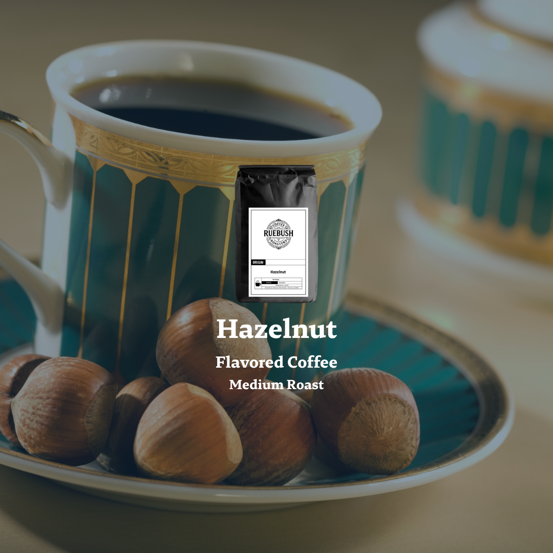 Mug with hazelnut flavored coffee package surrounded by hazelnuts on a saucer