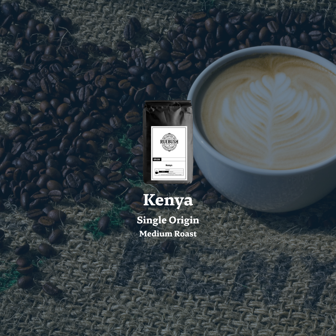 Cup of coffee with latte art, Kenya single origin coffee bag, and scattered coffee beans on a textured surface