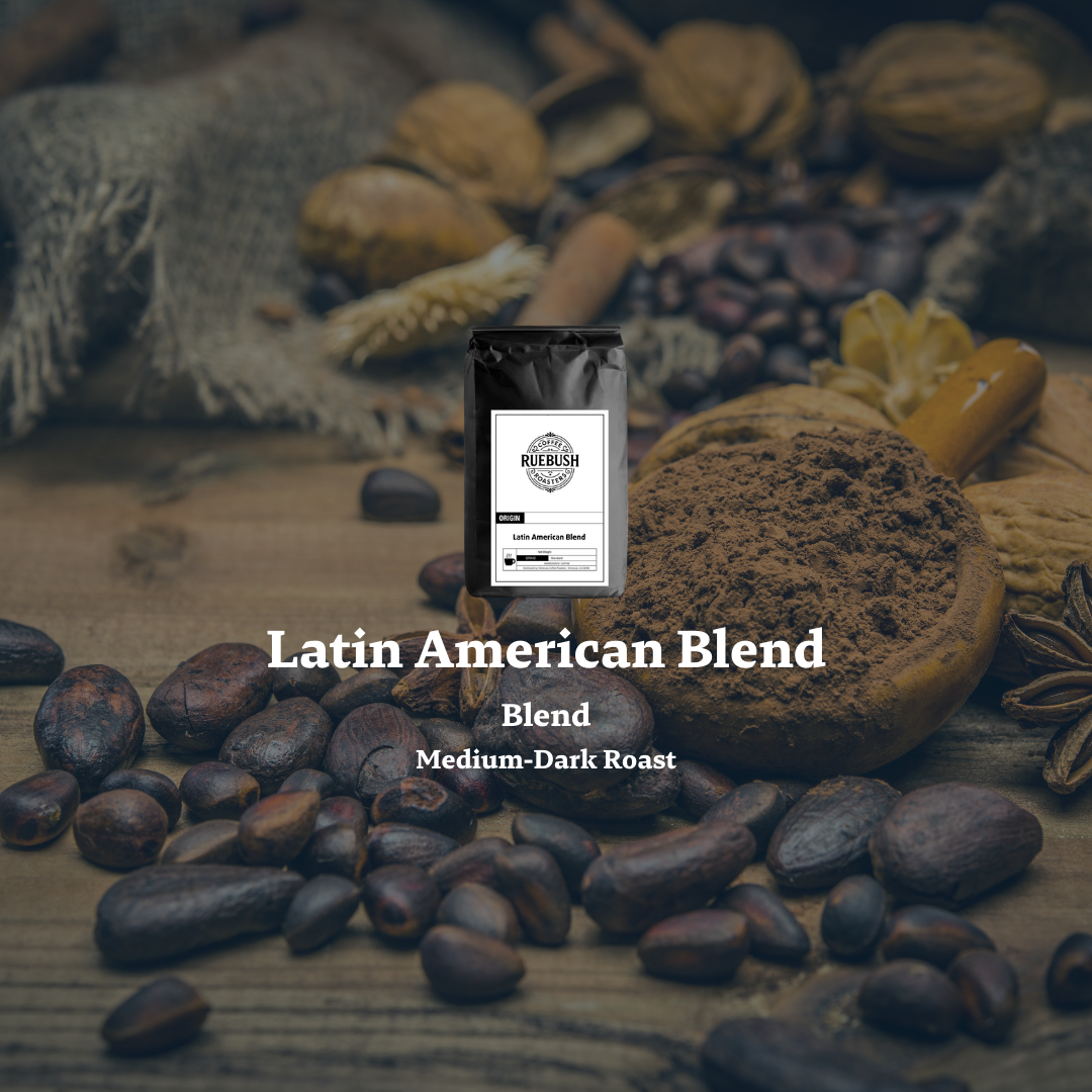 Coffee packaging labeled Latin American Blend surrounded by coffee beans and coffee-related items on a rustic background
