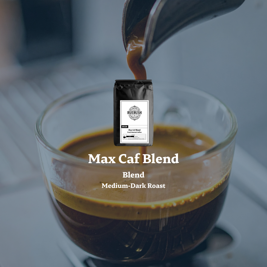 Coffee being poured into a glass with a Max Caf Blend package in the background by Ruebush Coffee Roasters