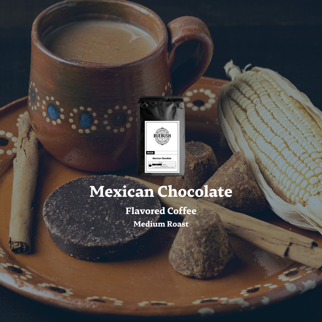 Ceramic mug with Mexican chocolate-flavored coffee, corn, and chocolate on a dark background