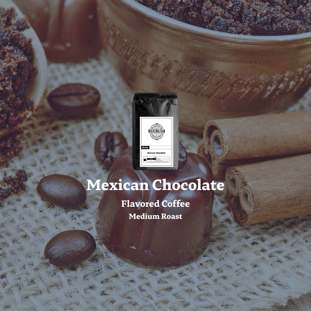 Mexican Chocolate Flavored Coffee package with coffee beans, chocolate, and cinnamon sticks on a textured surface.