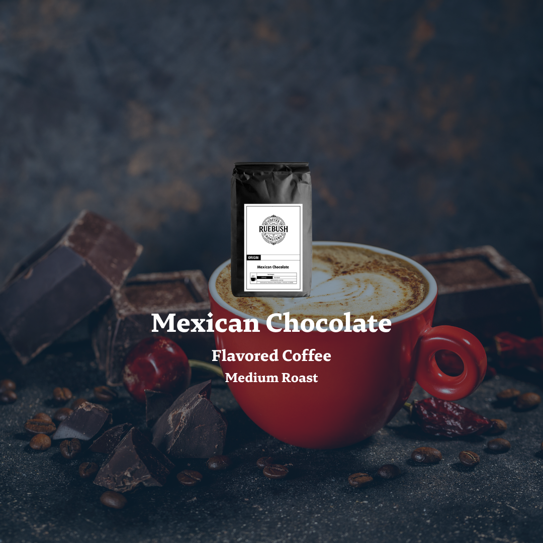 Red mug with Mexican Chocolate flavored coffee, surrounded by chocolate pieces and beans on a dark background