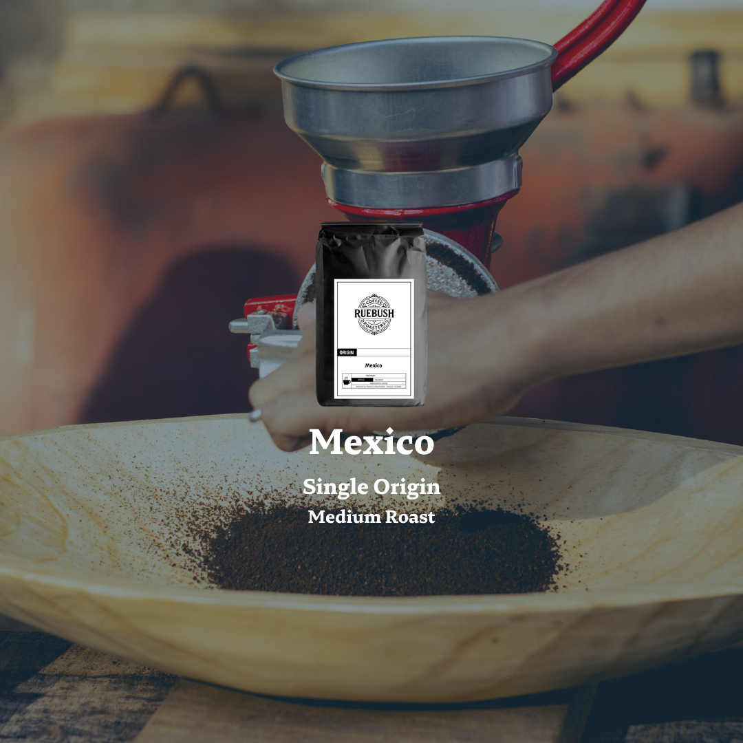 Coffee grinder with a bag of coffee labeled Mexico Single Origin Medium Roast on a wooden surface