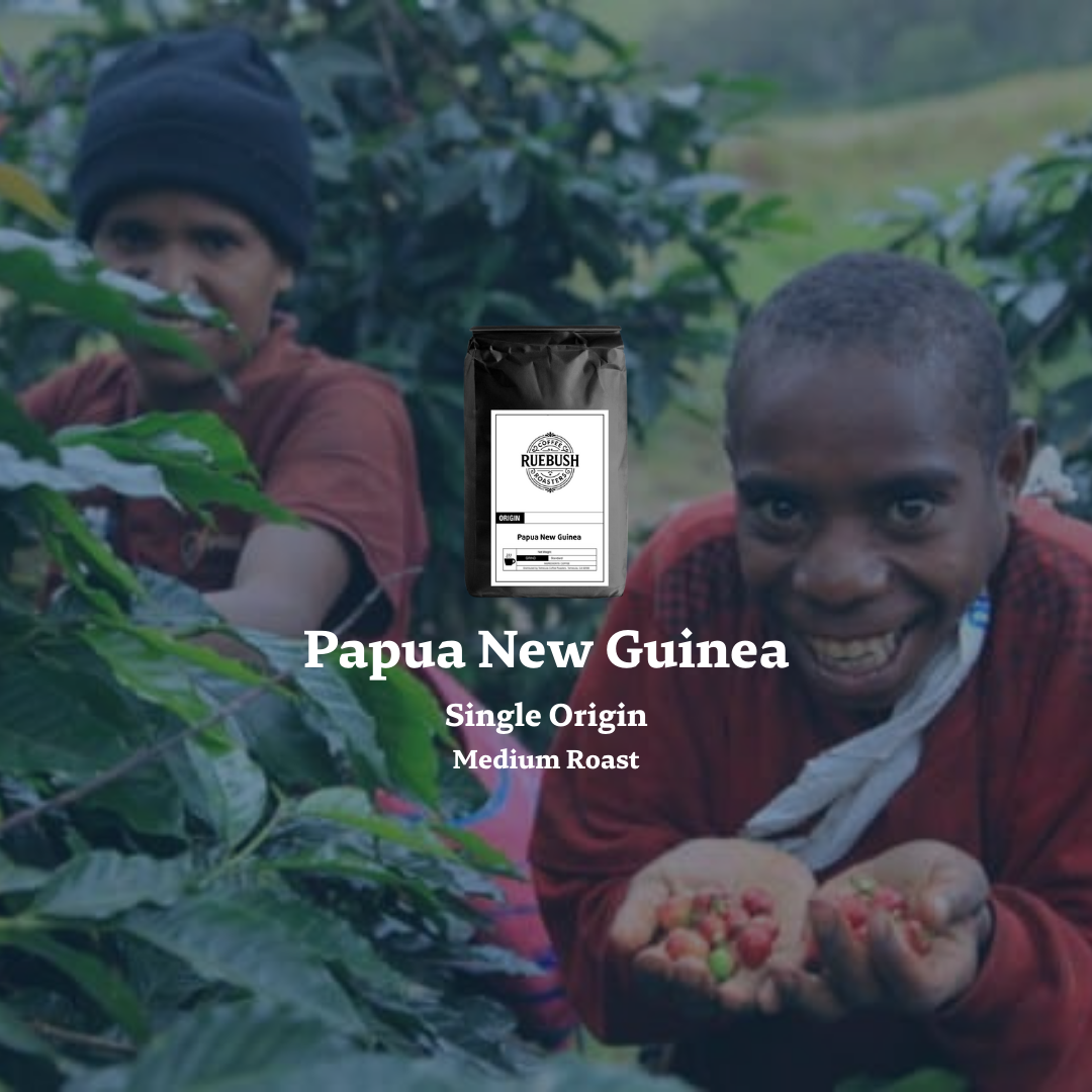 Two people with coffee beans and a coffee bag labeled Papua New Guinea on a blurred natural background