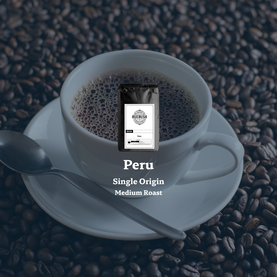 Cup of coffee with a Peru single origin coffee bag on a bed of coffee beans