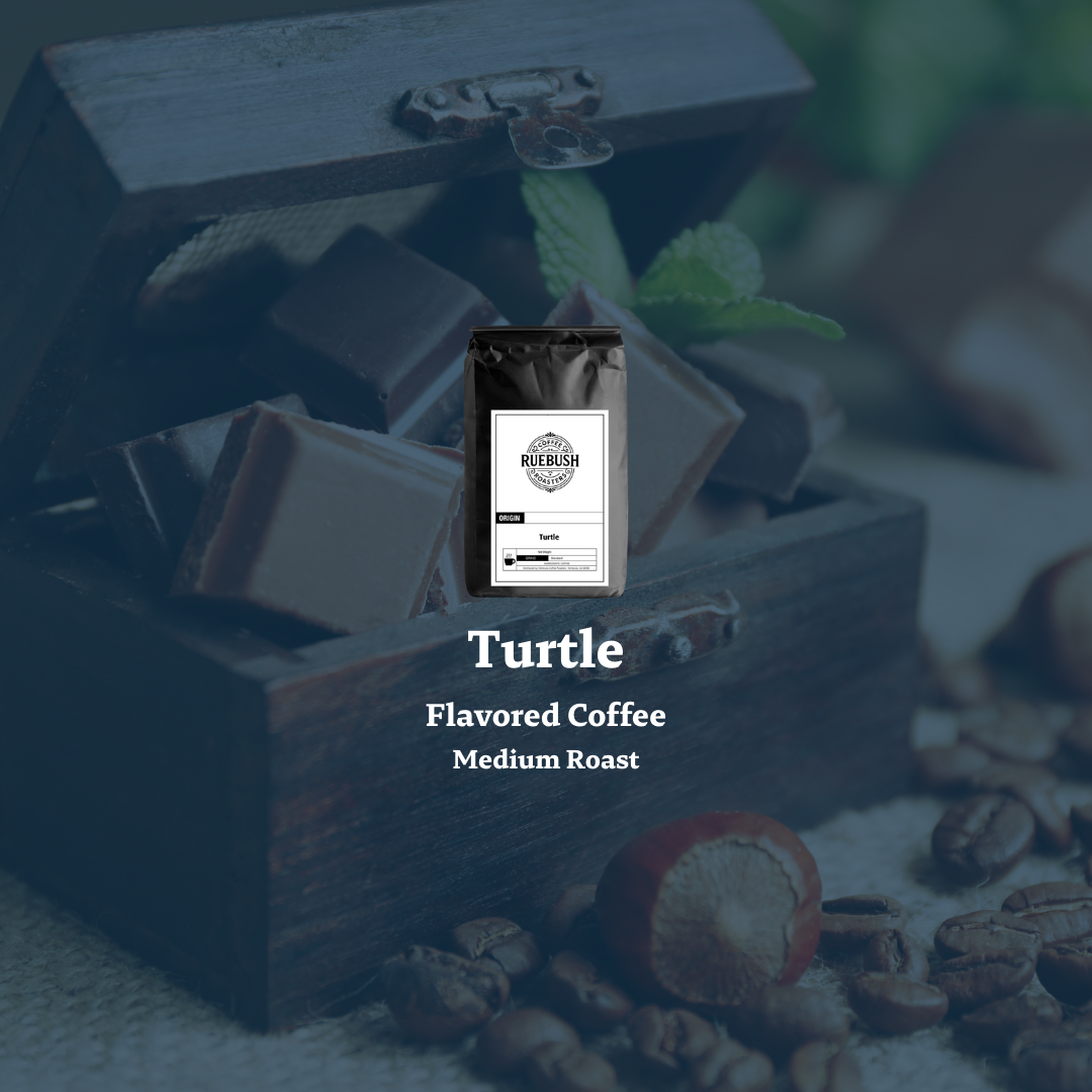 Packaged coffee labeled Turtle Flavored Coffee Medium Roast on a wooden chest with coffee beans and a chocolate bar.
