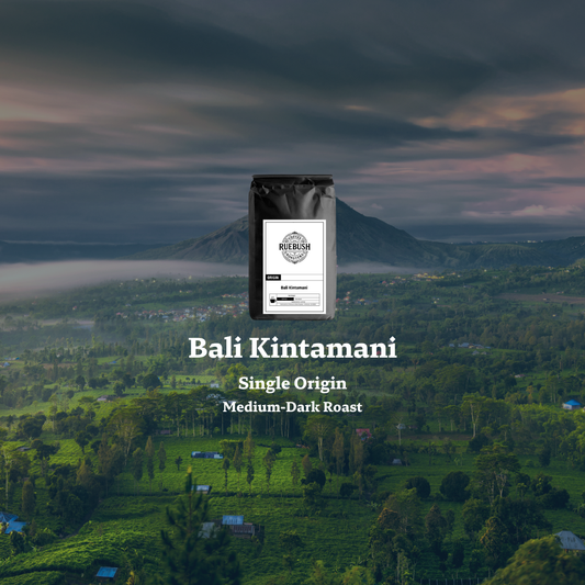 A scenic view of Bali with a mountain in the background, featuring the text Bali Kintamani Single Origin Medium-Dark Roast