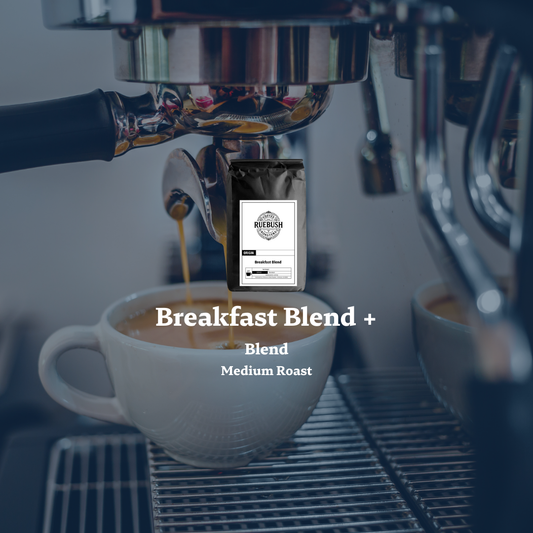 Espresso machine pouring coffee into a cup with Ruebush Coffee Roasters bag labeled Breakfast Blend + Blend Medium Roast.