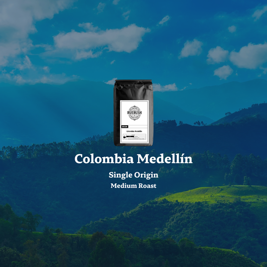 Scenic view of mountains with Colombia Medellín single origin coffee text overlay