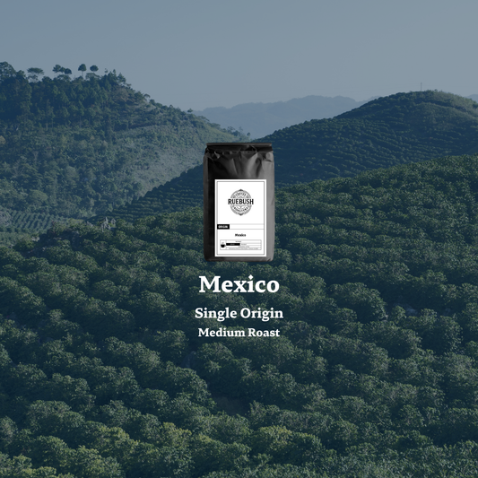 Coffee bag labeled Mexico Single Origin Medium Roast with a scenic background of green hills