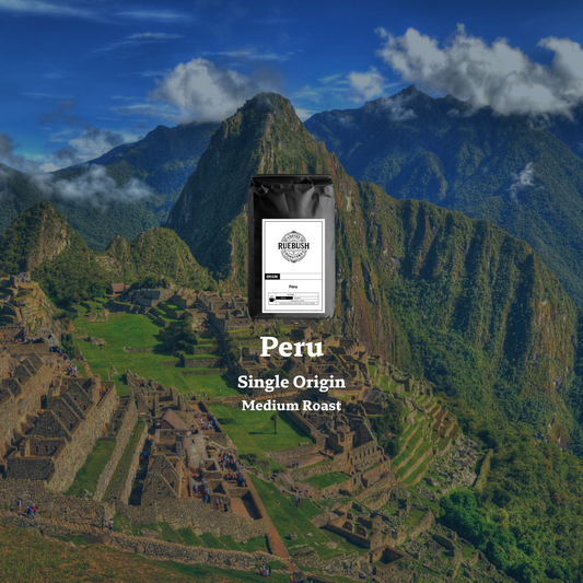 Coffee bag labeled Peru Single Origin Medium Roast with Machu Picchu in the background